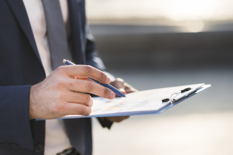 close-up-business-man-checking-clipboard - G Construction